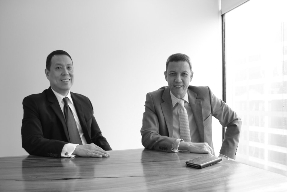 Mendoza & Pangan partners smiling at you.